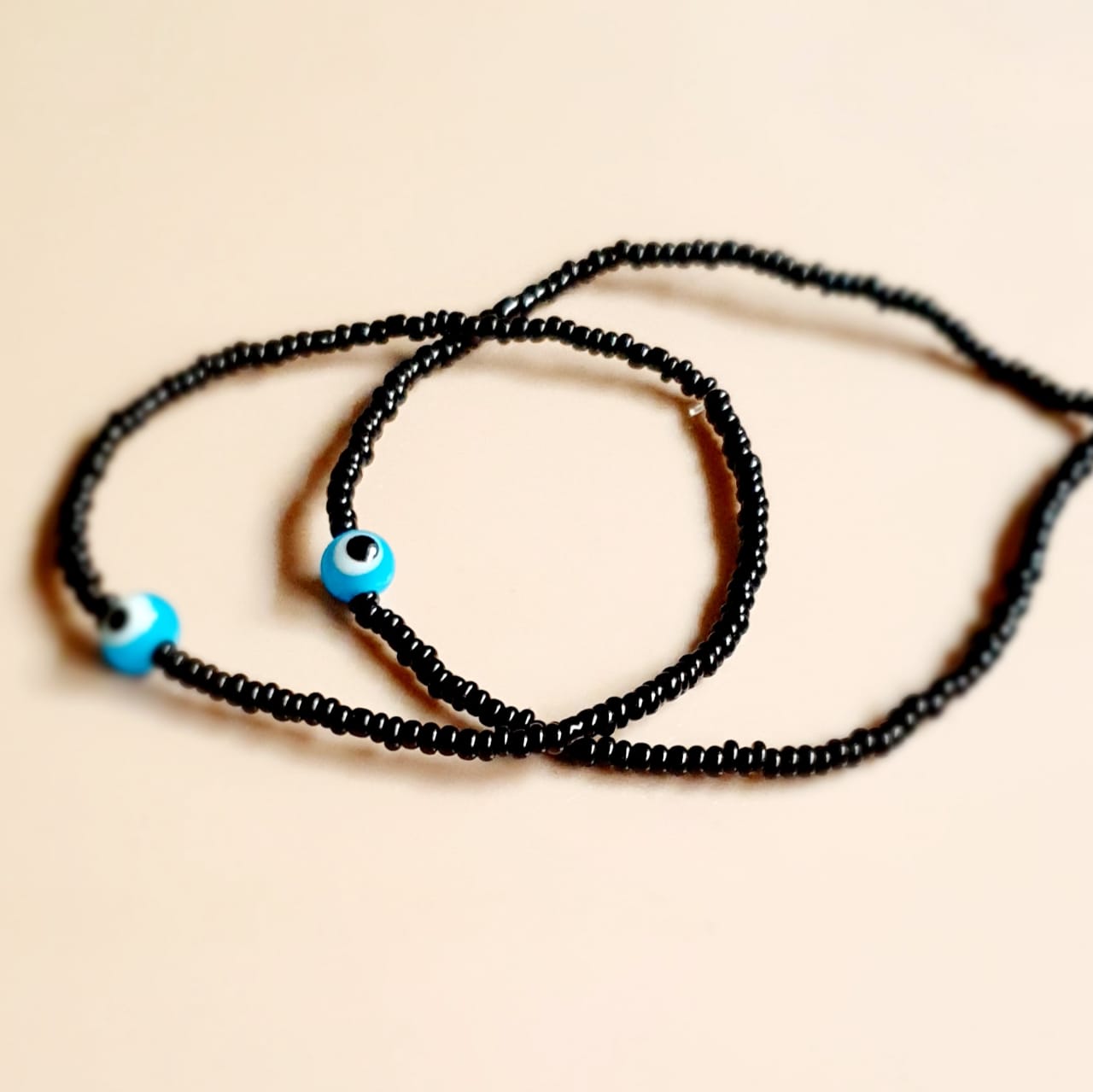 ATM Evil Eye Bracelet for Couples, Light Blue Evil Eye with Black Beads for Good Luck and Prosperity, Nazariya, Nazar Battu, Evil Eye Charm Bracelet , Flexi Cord (2 Pieces)