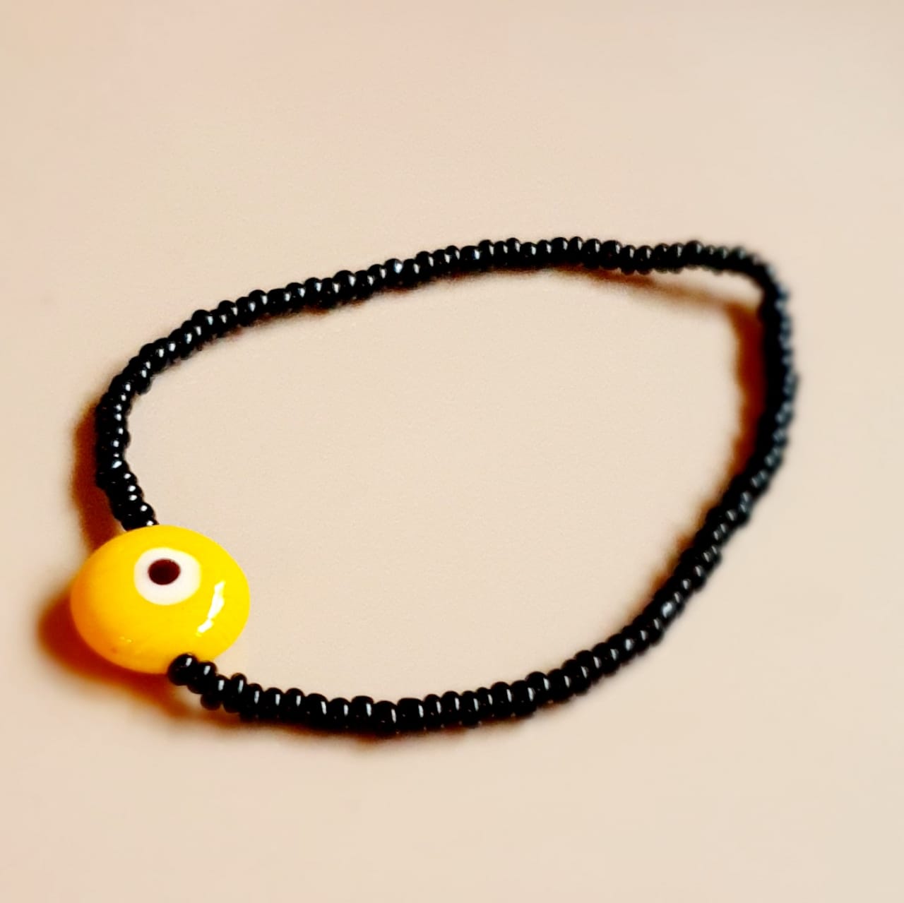 ATM Evil Eye Bracelet, Flat Yellow Evil Eye with Black Beads for Good Luck and Prosperity, Nazariya, Nazar Battu , Flexi Cord (1 Piece) (Yellow Evil Eye - Health and Concentration)