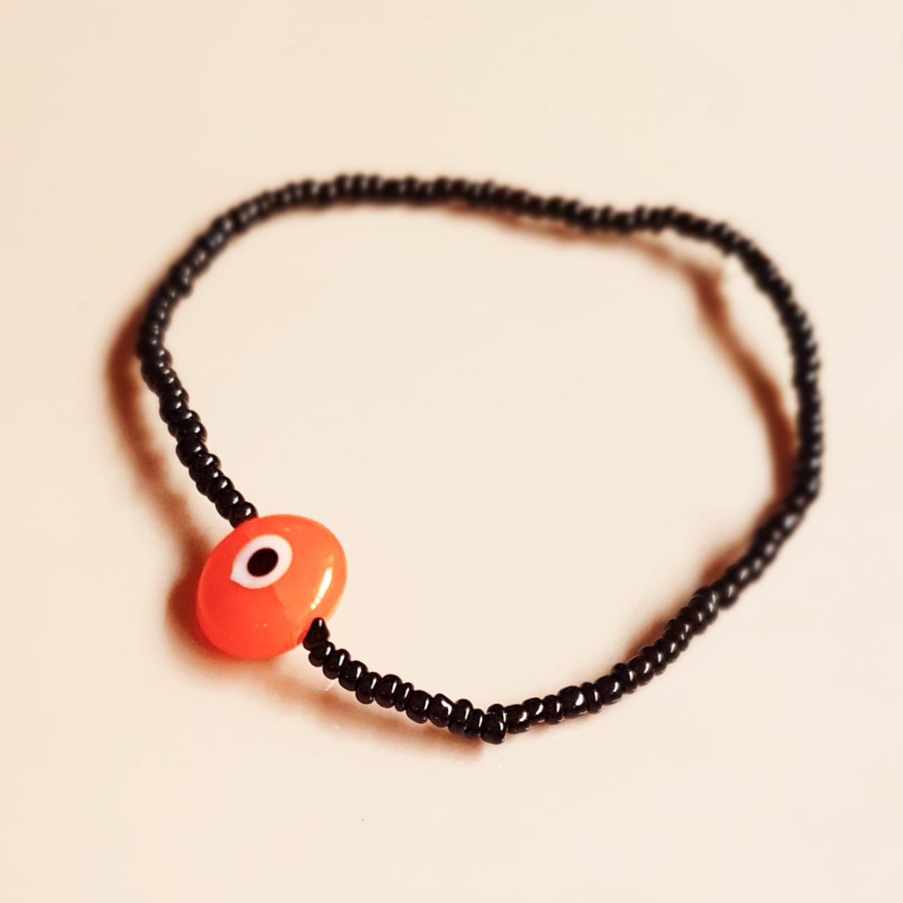 ATM Evil Eye Bracelet, Flat Orange Evil Eye with Black Beads for Good Luck and Prosperity, Nazariya, Nazar Battu , Flexi Cord (1 Piece) (Orange Evil Eye - Happiness, Protection and Creativity)