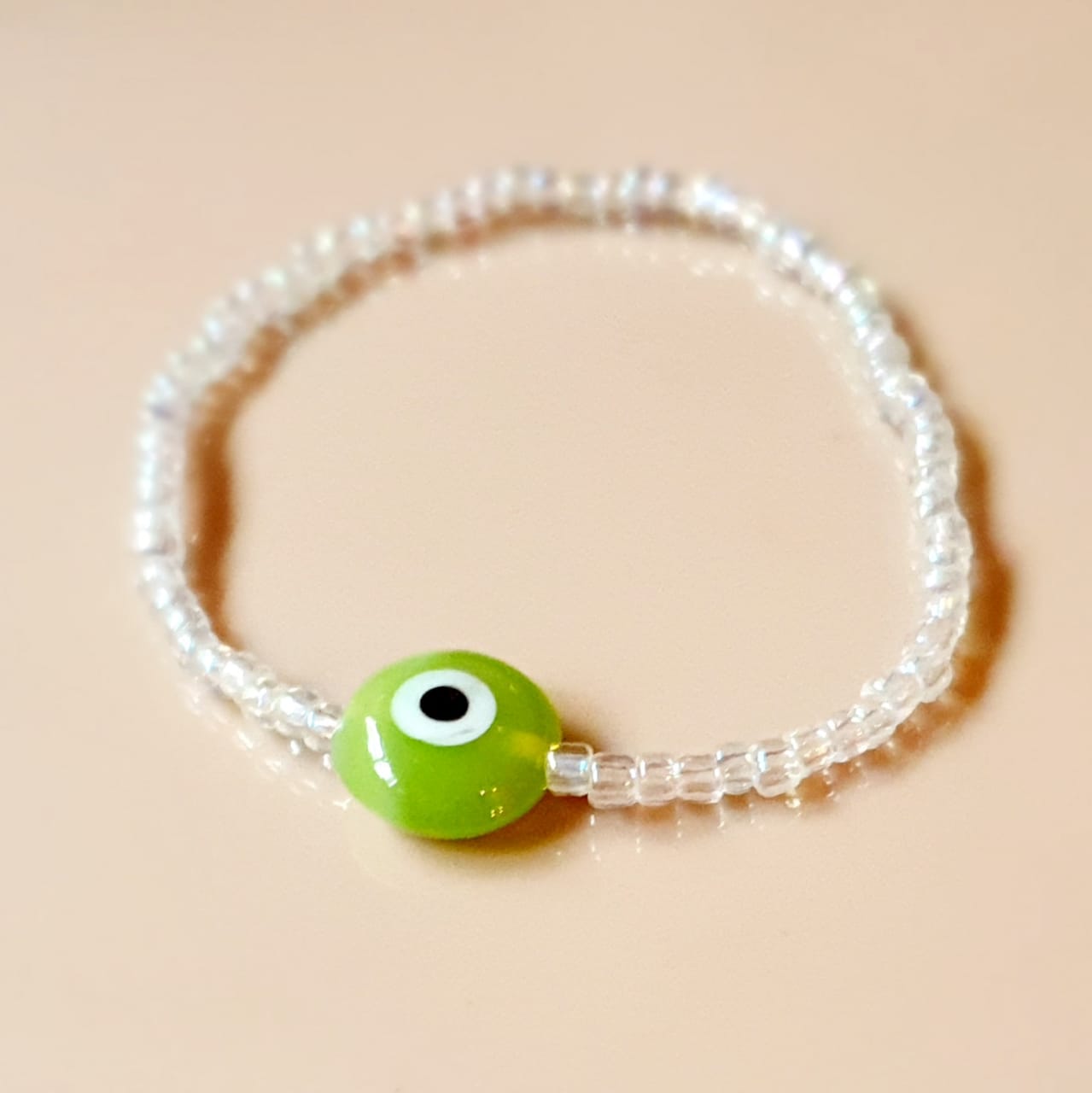 ATM Evil Eye Bracelet, Flat Light Green Evil Eye with Transparent Beads for Good Luck and Prosperity, Nazariya, Nazar Battu , Flexi Cord (1 Piece) (Light Green Evil Eye - Success and Good Health)